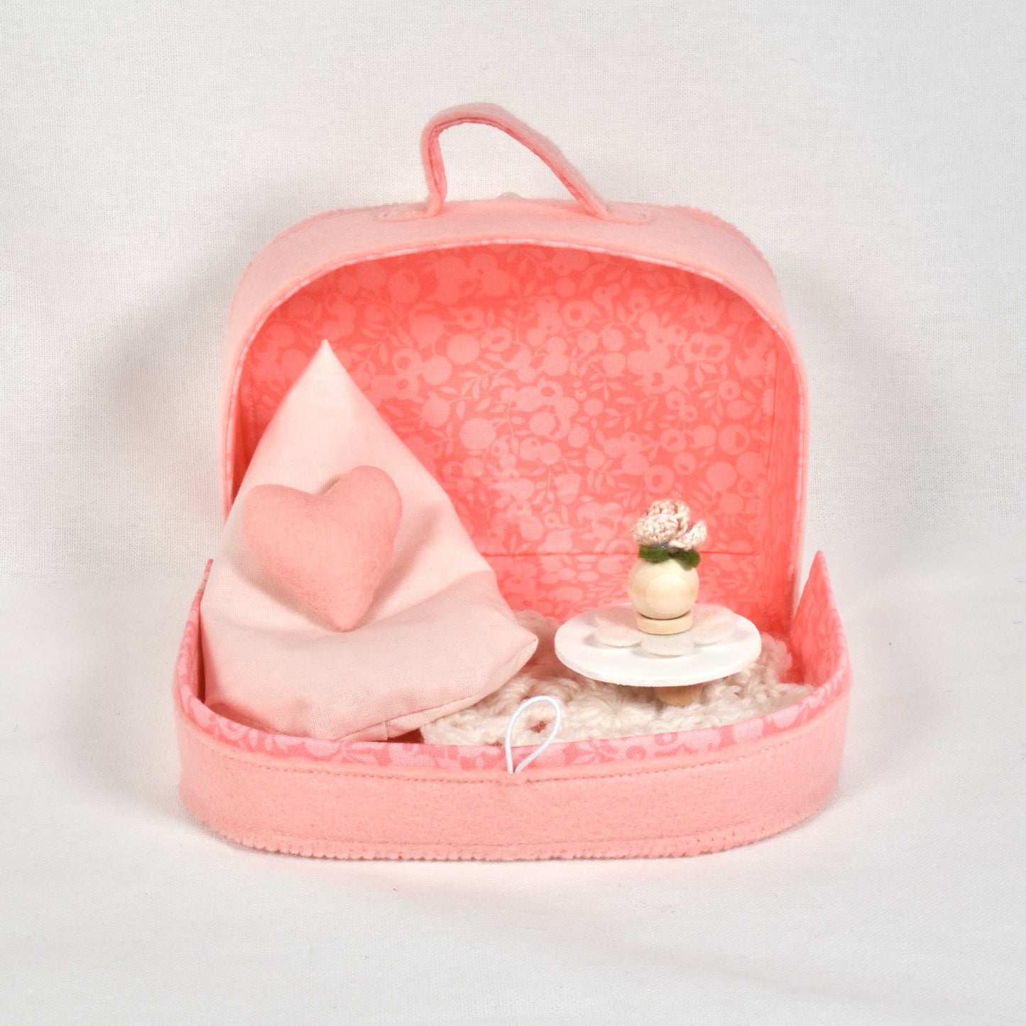 Suitcase with living room furniture